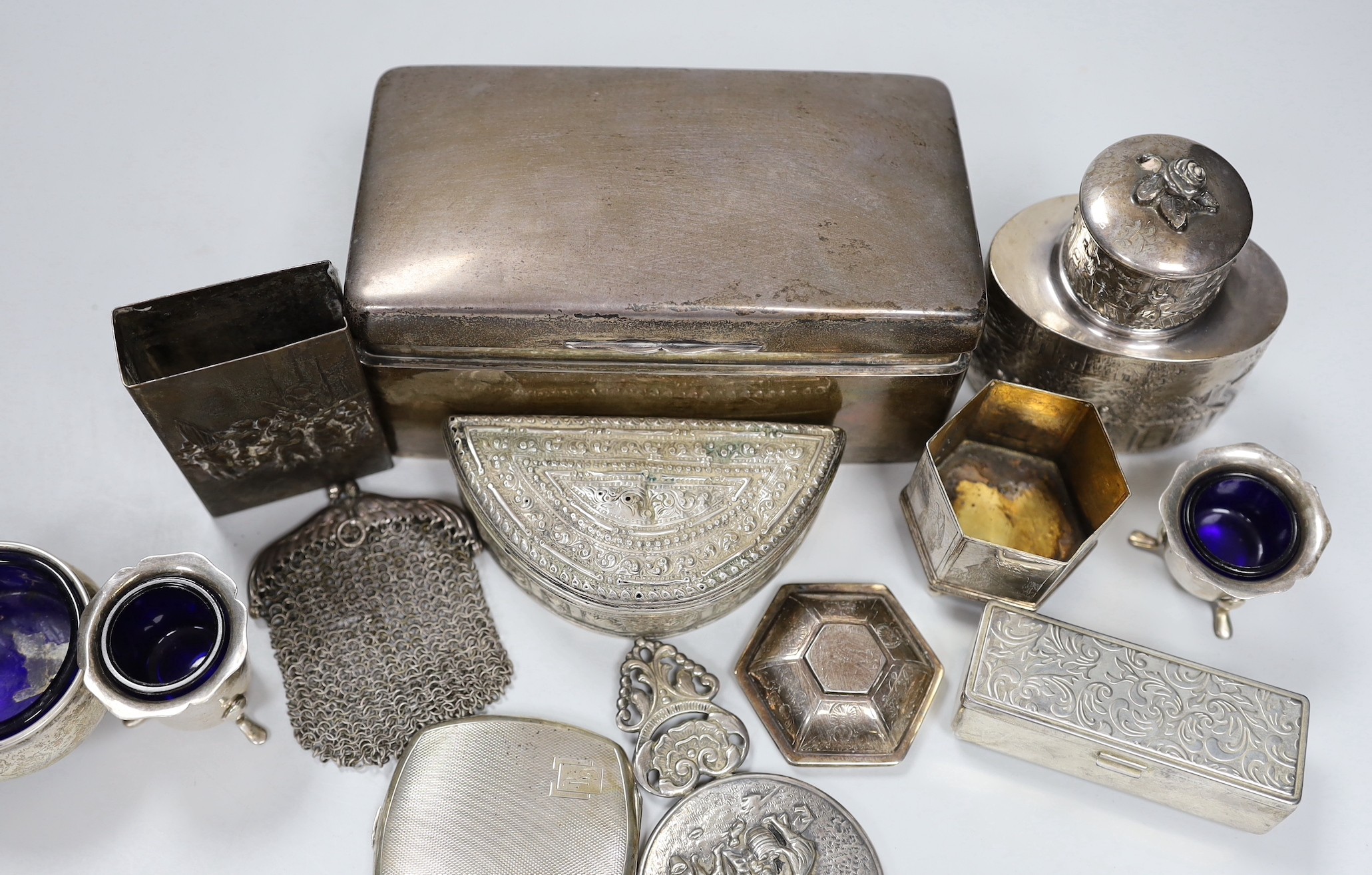 A George V silver mounted cigarette box, 16.9cm and a group of assorted white metal items.